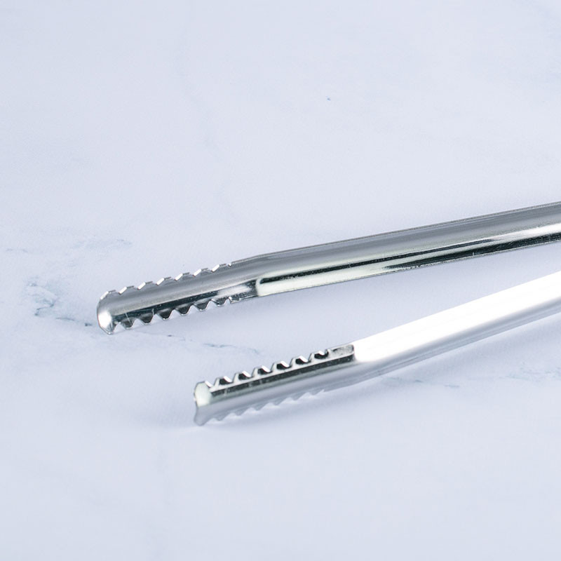 Pinza para carbón de parrilla