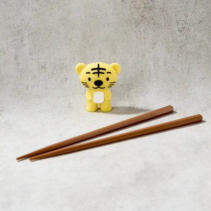 Chopsticks helper with pair of chopsticks